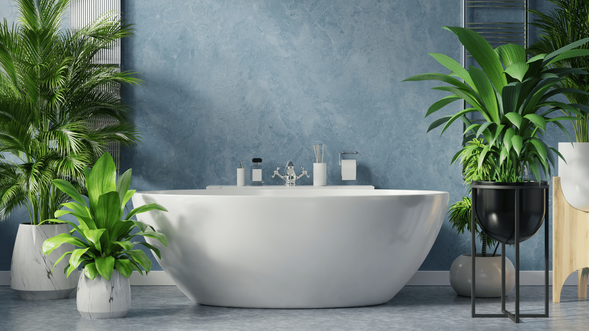 Serene, modern bathroom with a white oval freestanding bathtub centered against a soft blue textured wall; sleek chrome faucet and minimalist toiletries rest on the tub’s rim, while vibrant green potted plants in marble and black planters surround the scene, creating a lush spa-like atmosphere.