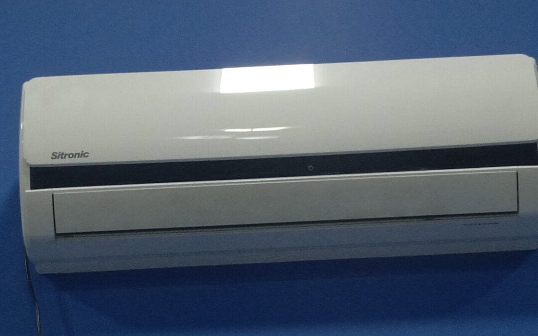 Modern air conditioning unit cooling a room in a UK home
