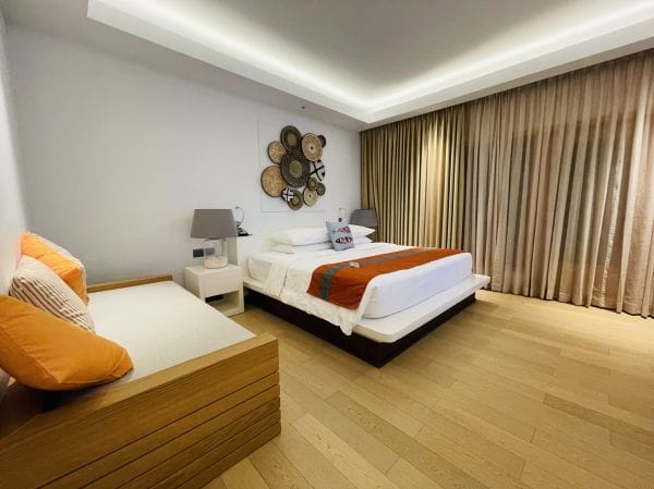 Bright modern bedroom with a neatly made bed