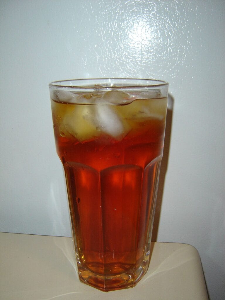 A glass filled with fresh ice cubes from a countertop ice maker