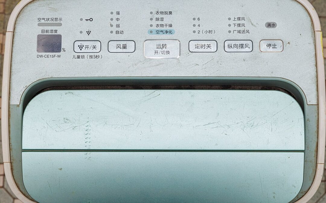 Dehumidifier running in a UK home to reduce damp