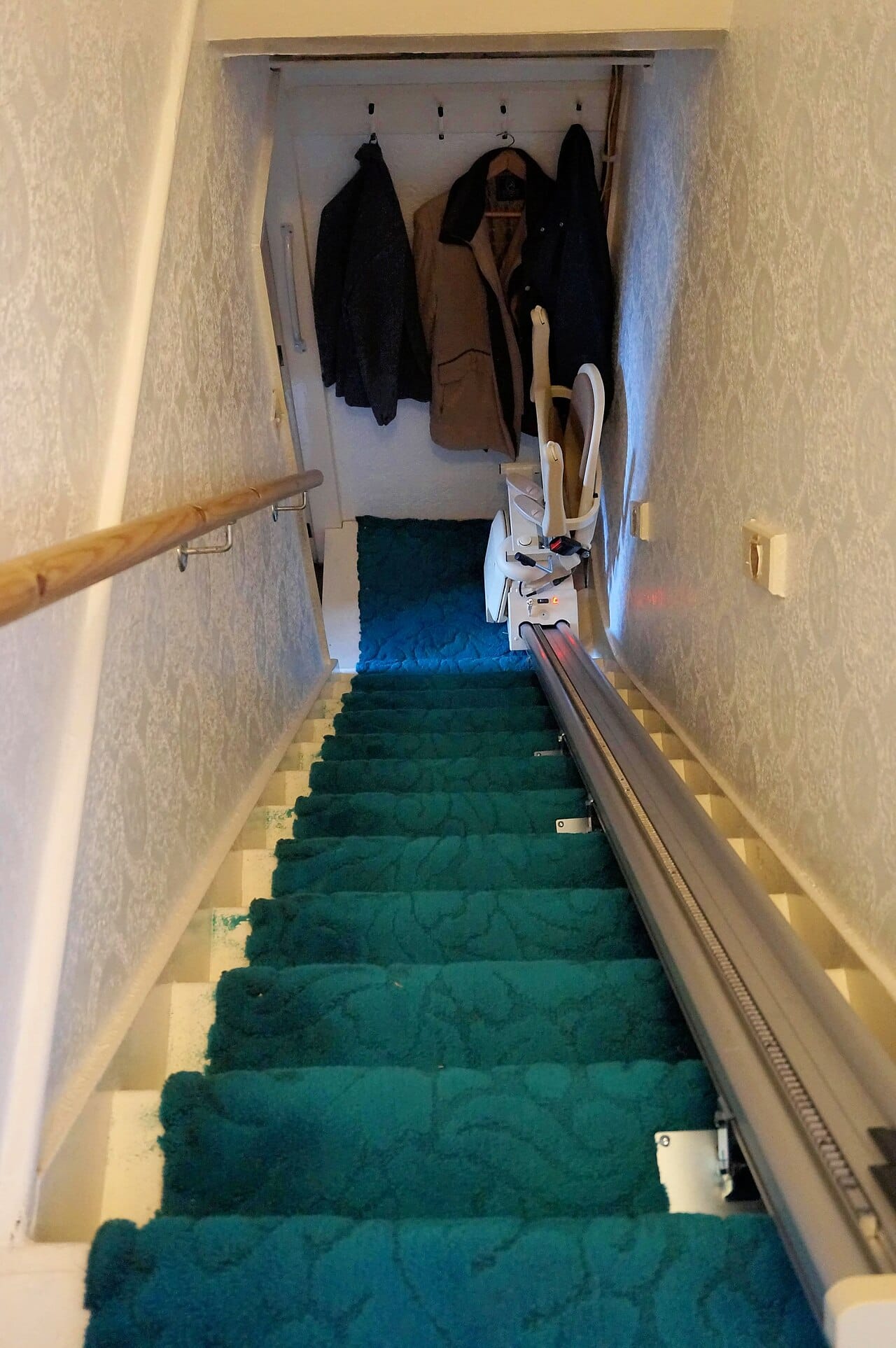 A stairlift installed on the stairs of a UK terraced house