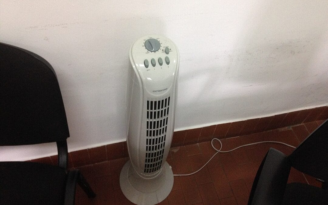 White tower fan cooling a room during a UK heatwave