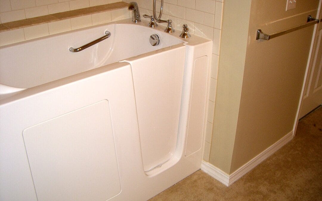 A walk-in bath with a side door and built-in seat