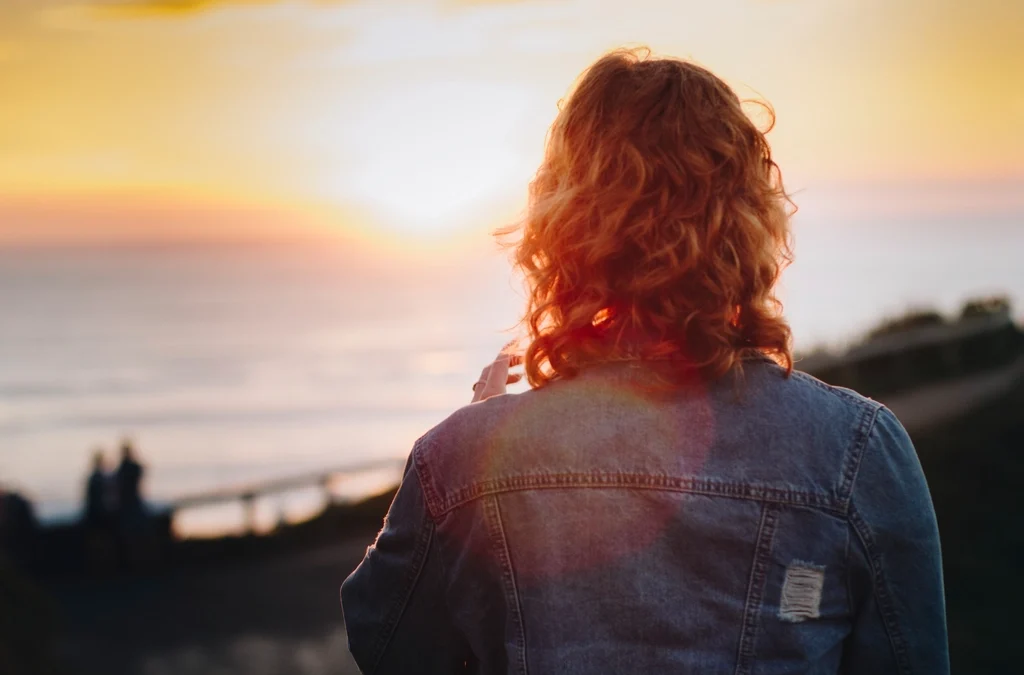 Person with long curly hair, illustrating results similar to overnight heatless curlers