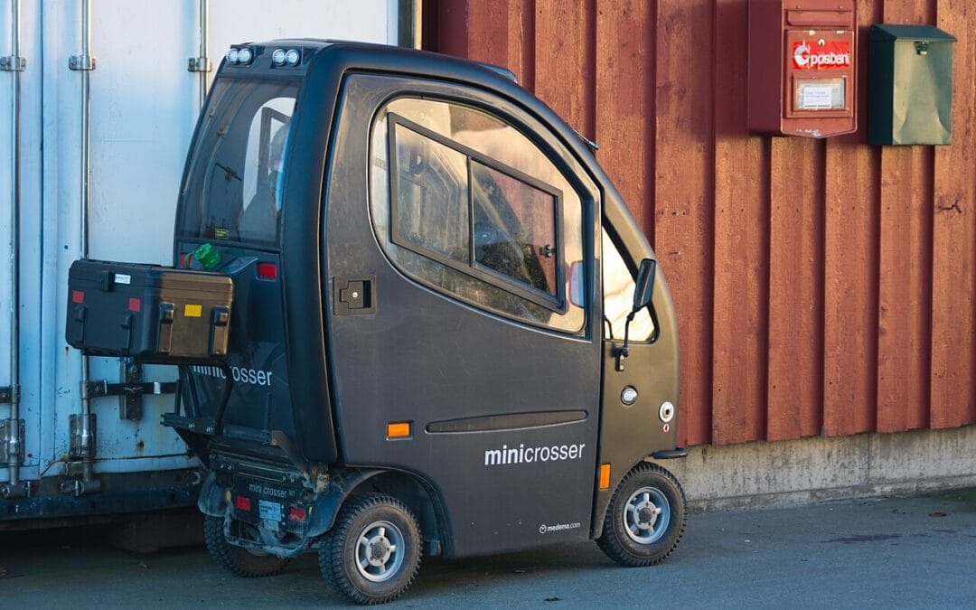 Person riding a mobility scooter outdoors