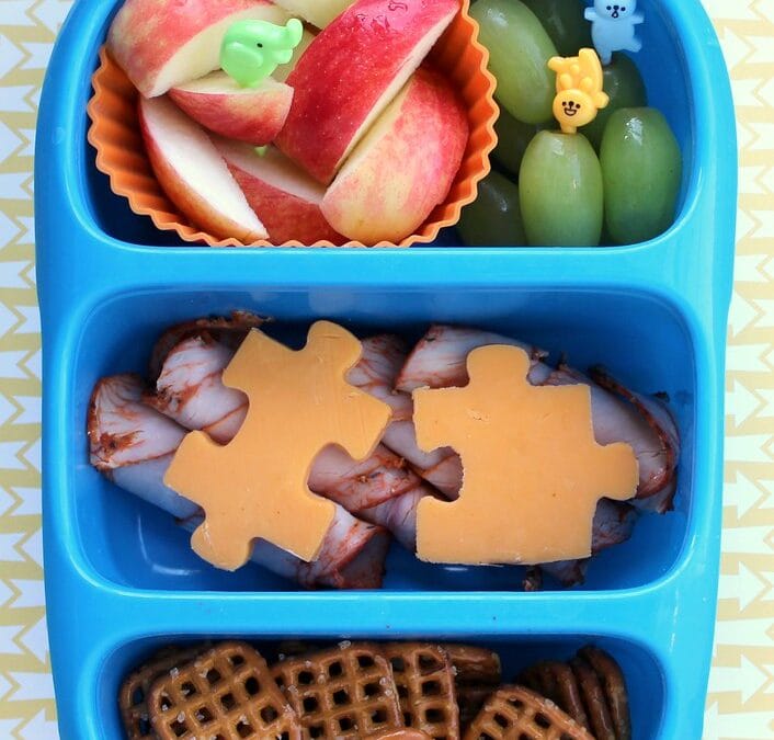 A bento lunch box packed with a colourful packed lunch