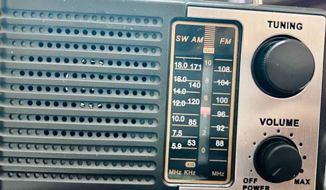 A small portable radio with tuning and volume dials
