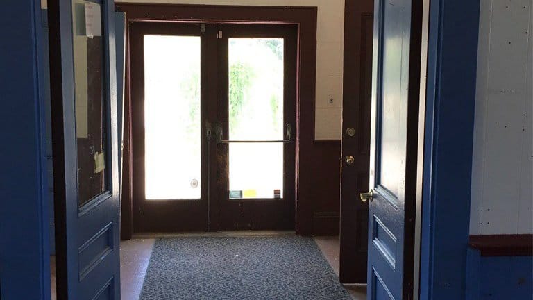 A front door seen from inside a hallway