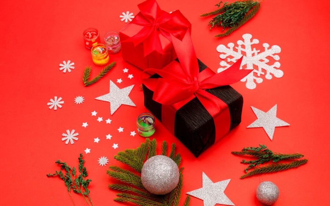 Wrapped gift boxes and decorations on a red background