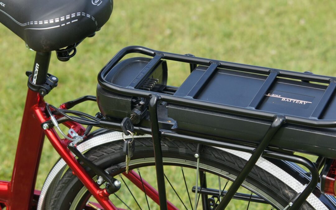 Close-up of an e-bike battery mounted on a rear rack