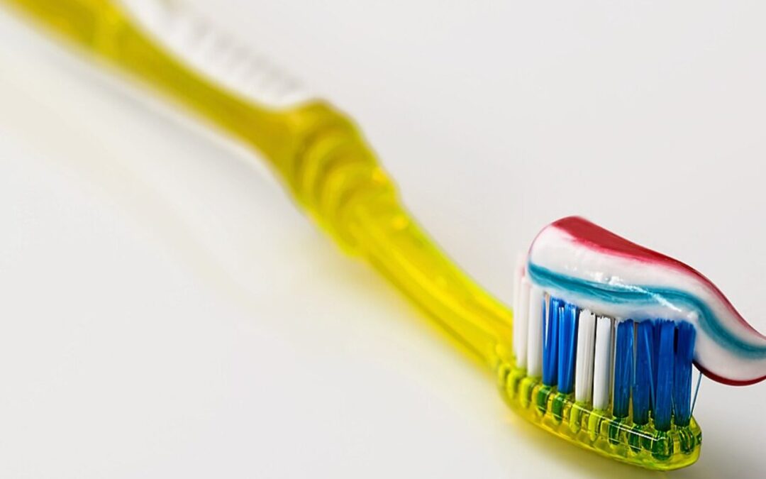 Close-up of toothbrush bristles with toothpaste, illustrating brush head wear